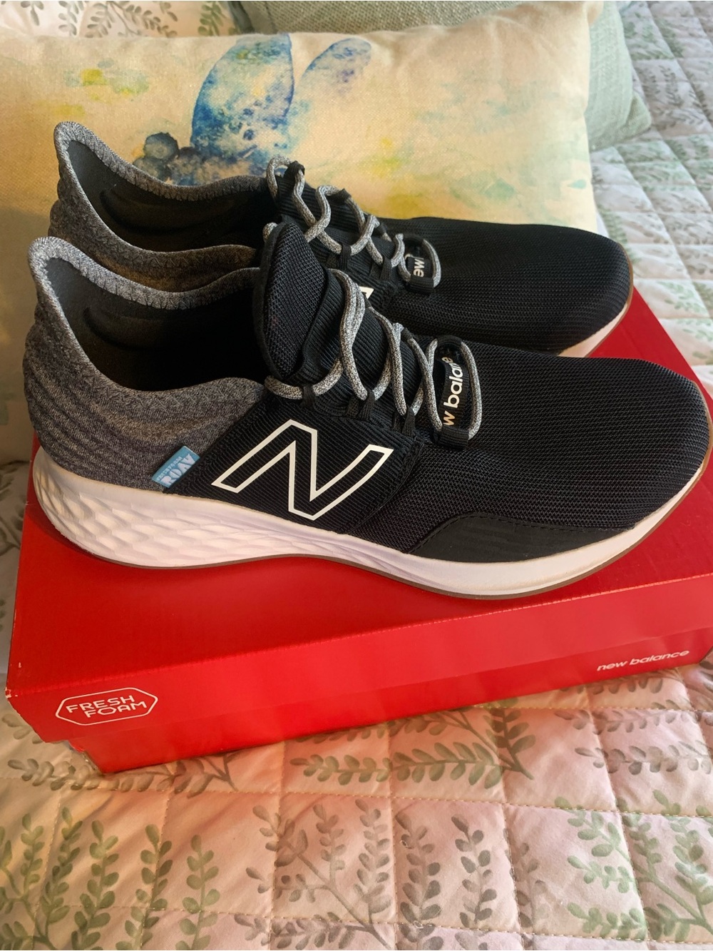 New Balance Foam Kids Black and Gray Athletic Running Shoes with White Midsole.